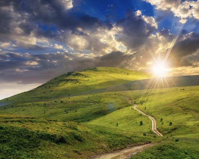 mountain path uphill to the sky at sunset